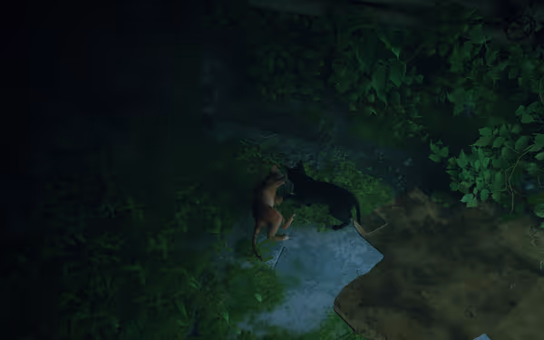 An orange and a black cat sit together on moss near a brown cloth in greenery.