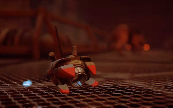 A small broken robot with red accents lies on a metal grate floor.